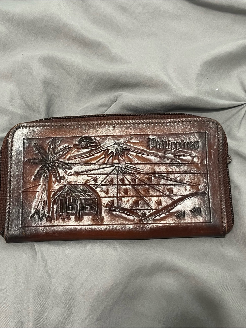 Vintage hand-tooled leather souvenir wallet with zipper